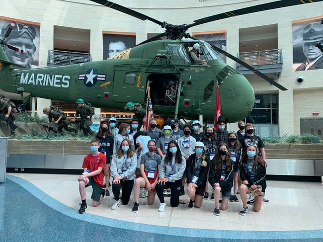 Students posing in museum
