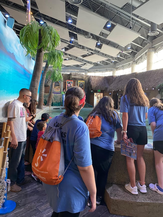 Students with BrightSpark swag learning on tour