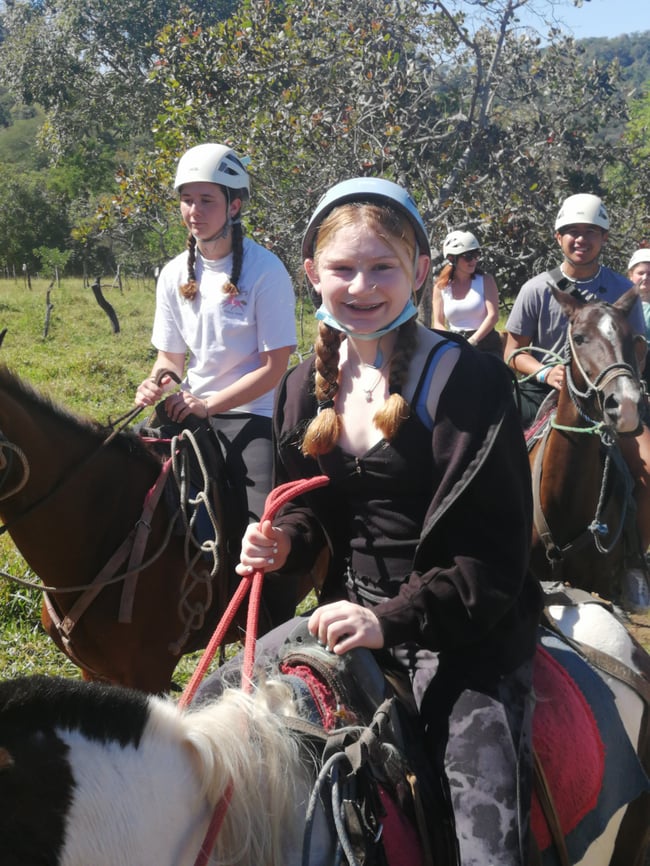 Student enjoying the horseback ride