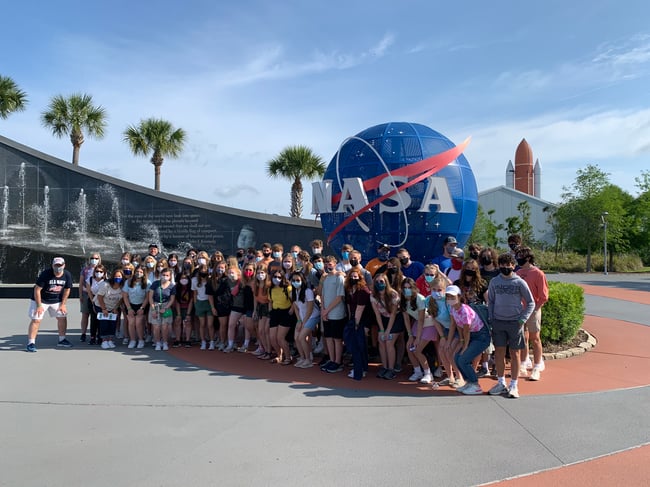 Posing with the NASA sign