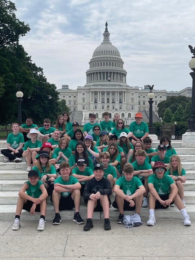 Group of students posing in front of the US Capitol