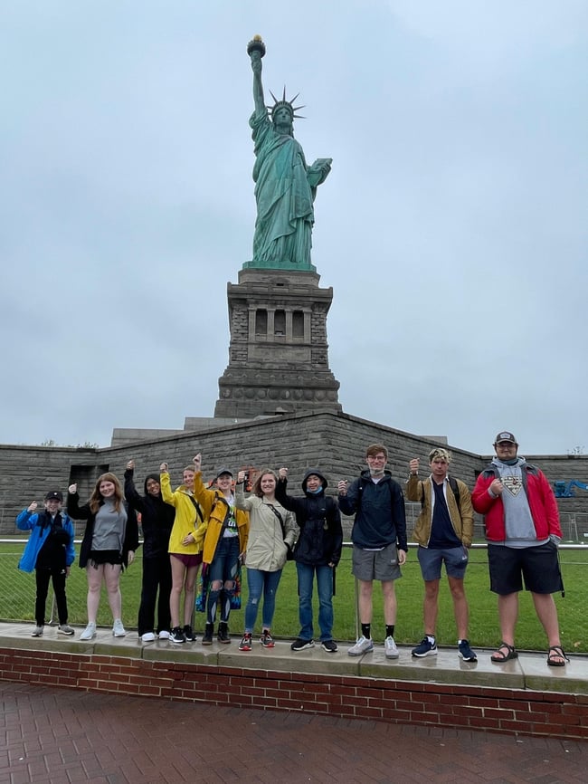 Students taking photograph in the Statue of Liberty