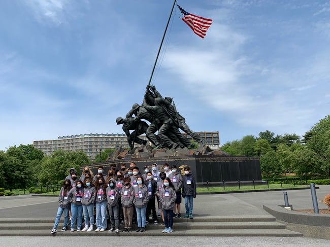 Group of kids in front of monument in Washington DC 